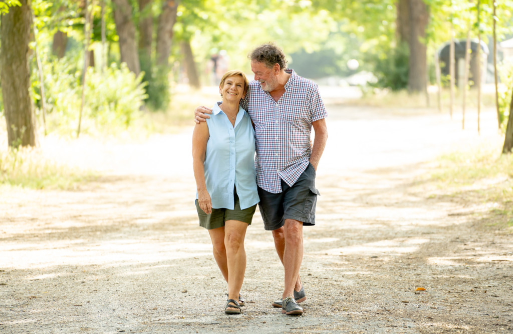Happy senior couple walking outdoors