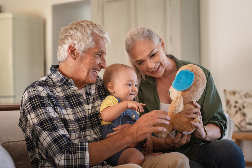 Grandparents playing with grandson