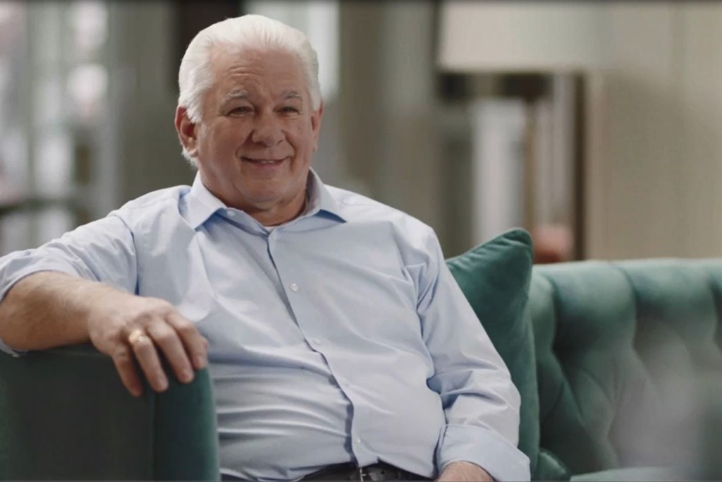 smiling man on couch